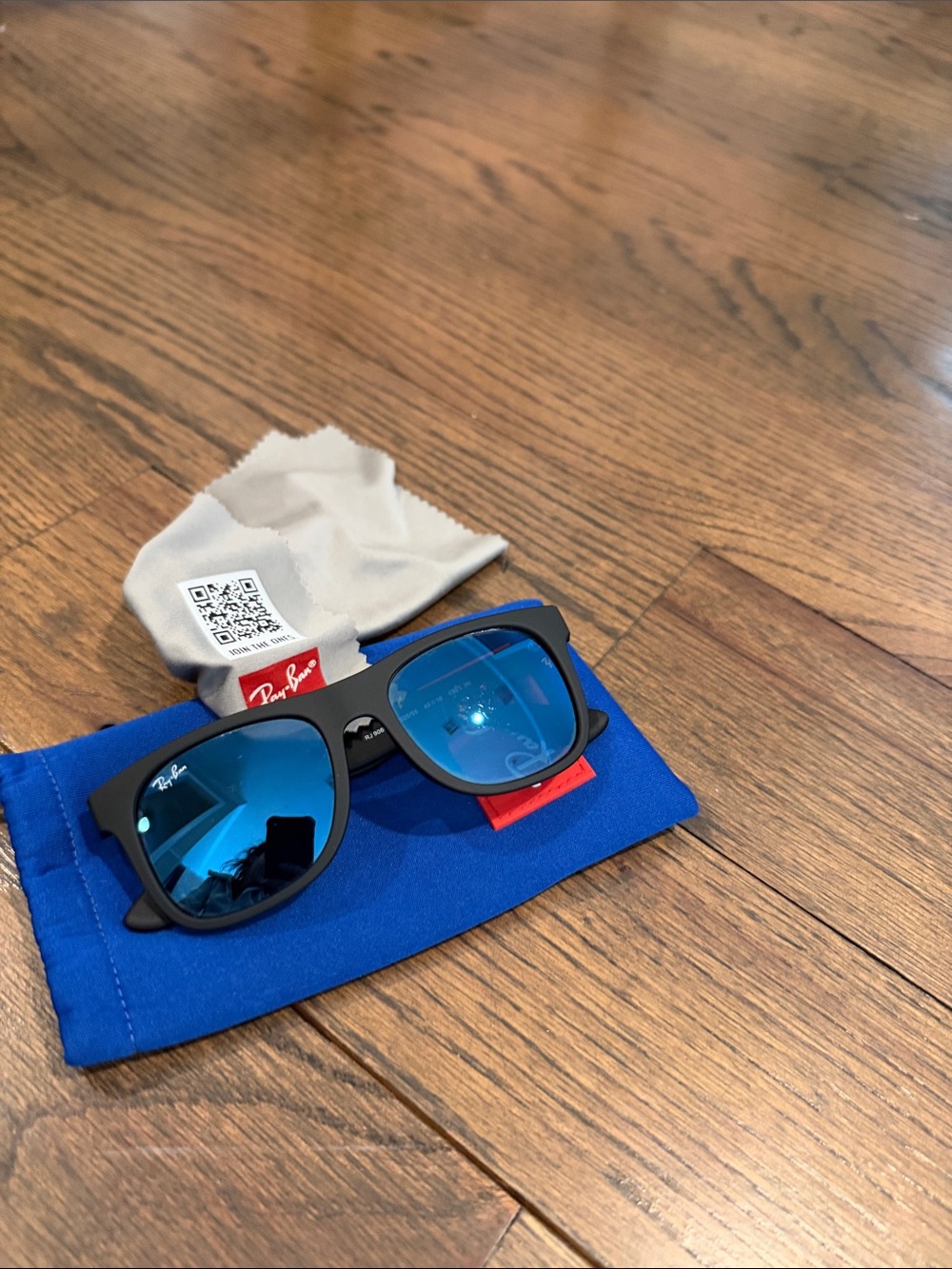 Ray-Ban Boy’s Black Frame Sunglasses with Blue Mirrored Lenses